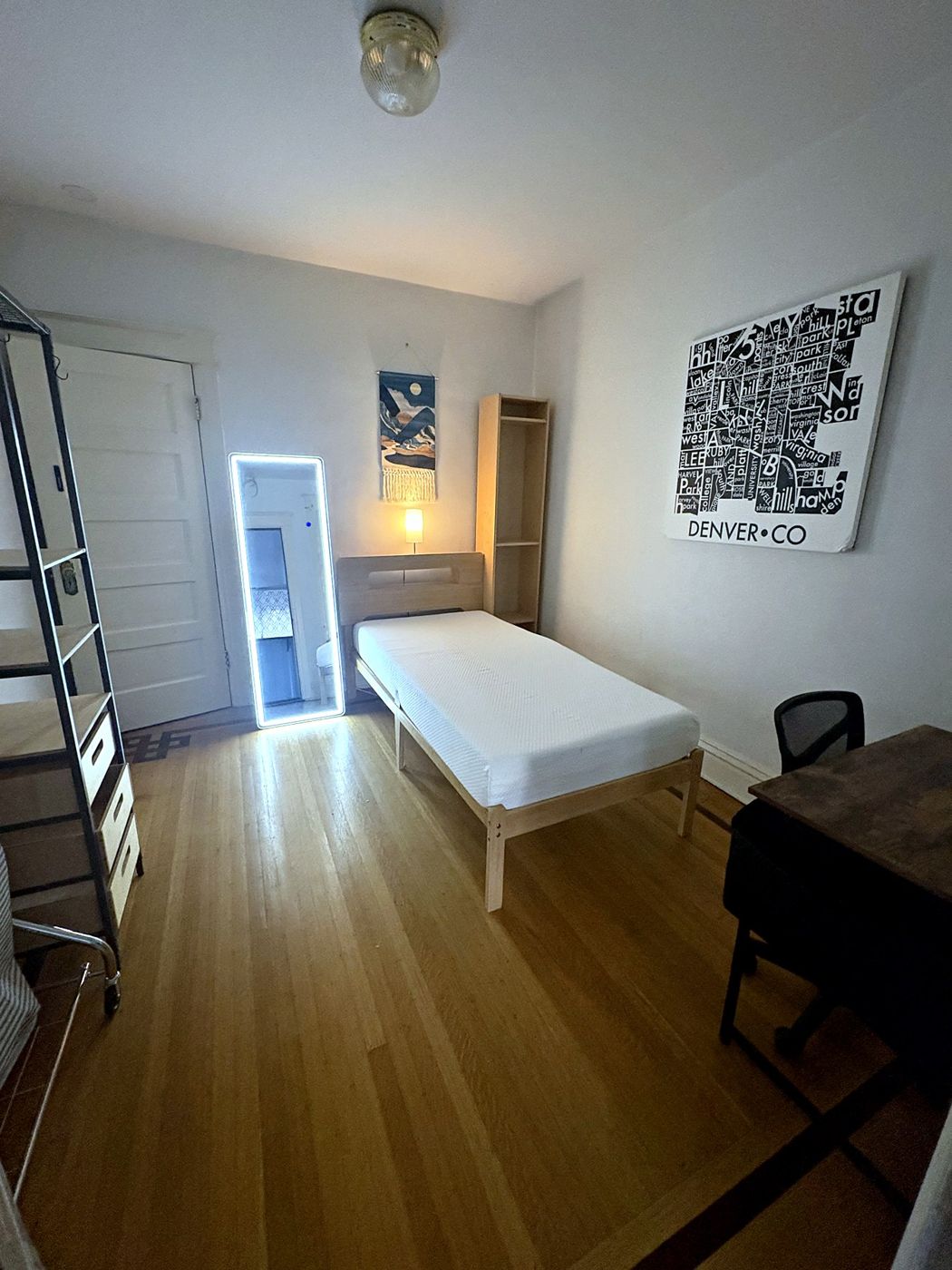Room 5 — twin bed, desk, Denver map art